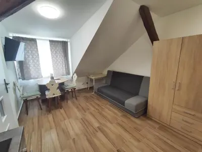a living room with a couch and a table at Kralovak in Králŭv Dvŭr