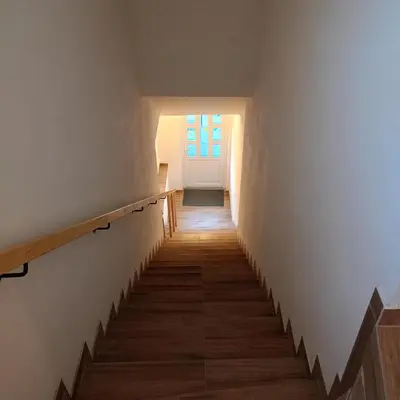 a staircase in a house with a window at Kralovak in Králŭv Dvŭr