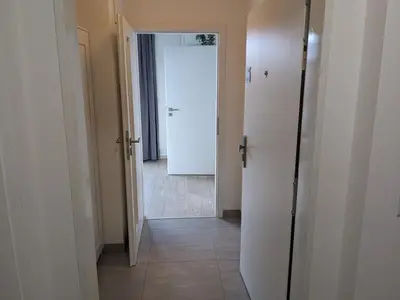a hallway with a door leading to a room at Cozy Apartment with Big Terrace in Central Prague - Karlín in Prague