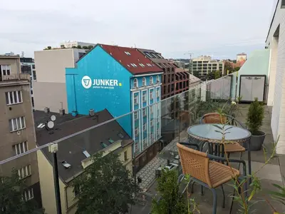 a blue building on the roof of a building at Cozy Apartment with Big Terrace in Central Prague - Karlín in Prague
