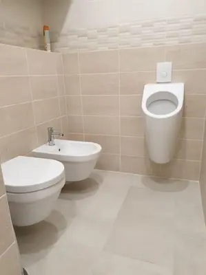 a bathroom with a toilet and a bidet at Prague Downtown Vinohrady - next to Havlícek Park in Prague