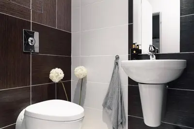 a bathroom with a white toilet and a sink at Prague Marina River View Apartment Close To City Centre FREE PARKING in Prague