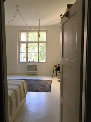 a bedroom with a bed and a window at Byt v srdci Žižkova Praha 3 in Prague