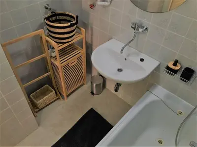 a bathroom with a sink and a toilet and a tub at Byt v srdci Žižkova Praha 3 in Prague
