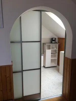 an archway with a mirror in a room at Penzion Panorama in Beroun