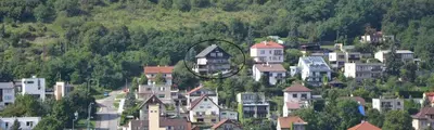 a group of houses on a hill with a circle at Penzion Panorama in Beroun