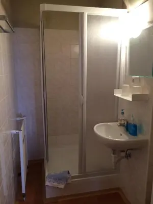 a bathroom with a shower and a sink at Penzion Panorama in Beroun