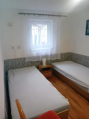 a room with two beds and a window at Rekreační chata Kocába in Štěchovice