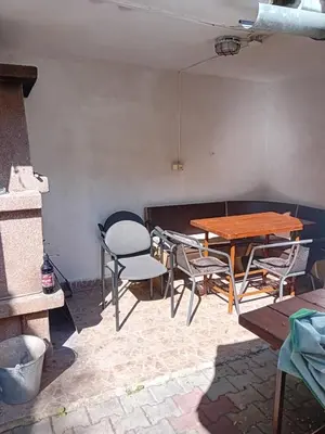 a table and chairs in a room with a table and chairs at Rekreační chata Kocába in Štěchovice
