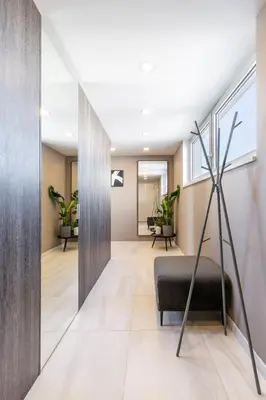 a living room with a black couch in the middle at TurnKey I Central Apartment with Terrace in Prague