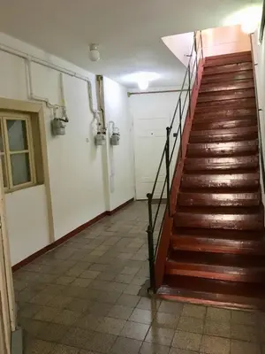 an empty hallway with stairs in a building at Historic Centre Apartments II in Prague