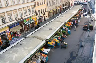 an overhead view of an outdoor market with people walking around at Historic Centre Apartments II in Prague