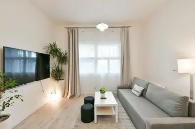 a living room with a couch and a table at Kubelíkova 32 Residence in Prague