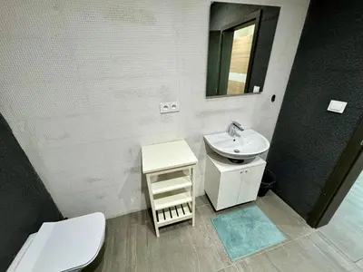 a bathroom with a sink and a toilet and a mirror at Byt apartman 74m2 vyhled klid priroda in Prague