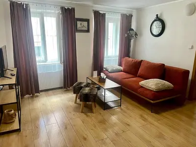 a living room with a couch and a table at U Zeleného jalovce in Prague