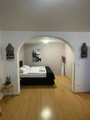 a bedroom with a bed in an arch way at U Zeleného jalovce in Prague