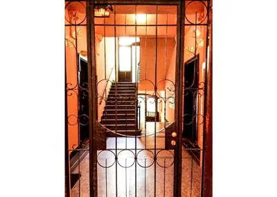 an open door with a view of a stairway at Modern Apartment Riegrovy sady in Prague