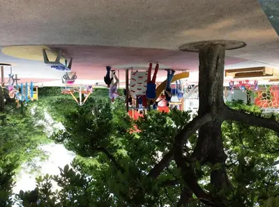 a room with a bunch of surfboards hanging from a ceiling at Modern Apartment Riegrovy sady in Prague