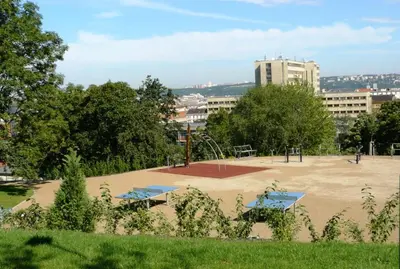 a park with two picnic tables and a playground at Modern Apartment Riegrovy sady in Prague