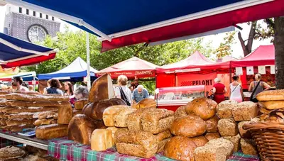 a display of breads and pastries at a market at Modern Apartment Riegrovy sady in Prague