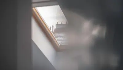 a view of a stairway in a room with a window at ModaLoft Duplex by Rentez in Prague