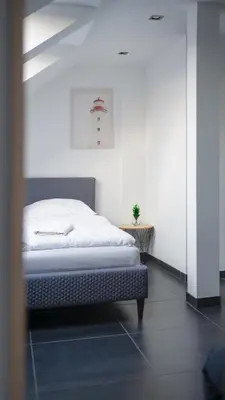 a bedroom with a bed in a room at ModaLoft Duplex by Rentez in Prague