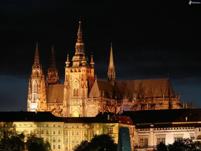 a large building with a clock tower on top of it at The Bookhouse, 5-bedroom residence by Prague Castle in Prague