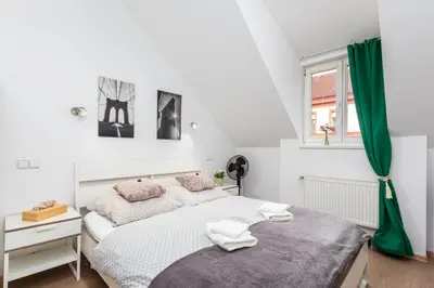 a bedroom with two beds and a window at Private Retreat Close to Stations in Praha 3 in Prague