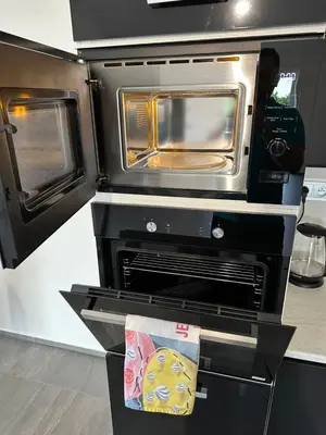 a kitchen with an oven with a microwave at Byt apartman 73m2 Klid příroda Parking FREE in Prague