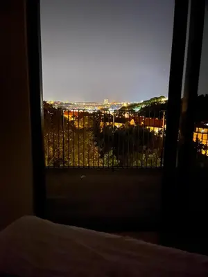a room with a window with a view of a city at Luxury Penthouse Prague in Prague