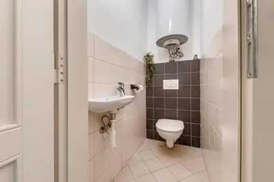 a bathroom with a sink and a toilet at King´s Road Residence in Prague