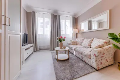 a living room with a couch and a table at King´s Road Residence in Prague