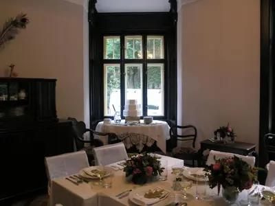 a dining room with a table and a window at Vila Olga in Jevany