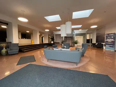 a lobby with a couch and chairs in a building at DE LUXE Apartment, WIFI, TV 65