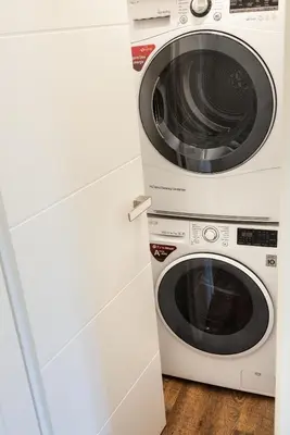 two washing machines are sitting next to each other at Apartmán 3kk - 115m2 v klidné lokalitě - Praha 4 in Prague