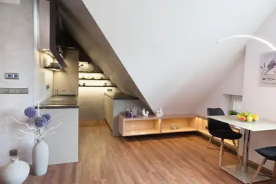 a kitchen with a table and a dining room at Apartmán 3kk - 115m2 v klidné lokalitě - Praha 4 in Prague