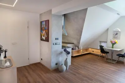 a large living room with a table and chairs at Apartmán 3kk - 115m2 v klidné lokalitě - Praha 4 in Prague