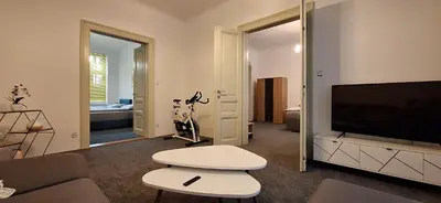 a living room with a couch and a flat screen tv at City center apartment Thomas No1 in Prague