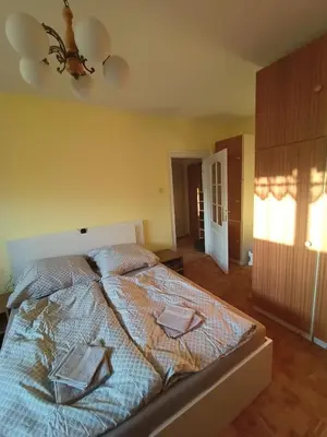 a bedroom with a bed with two books on it at Zálesí in Prague