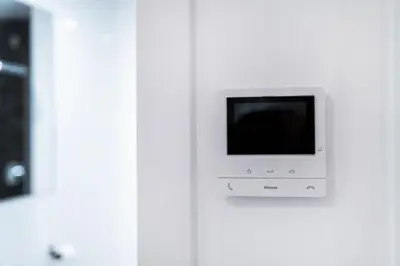 a small television on a white wall in a room at Anytime Holiday- Muzeum Apartments in Prague