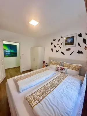 a bedroom with a large bed in a room at Cozy Sapa Stay - Private Apartment and Room in Prague