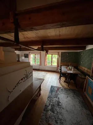 a large room with a table and a room with a table at Chaloupka v srdci Křivoklátska in Rakovník