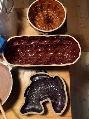three bowls of food sitting on a wooden table at Chaloupka v srdci Křivoklátska in Rakovník