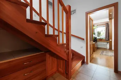 a wooden staircase in a home with a hallway at Entire house with garden near Prague in Benešov