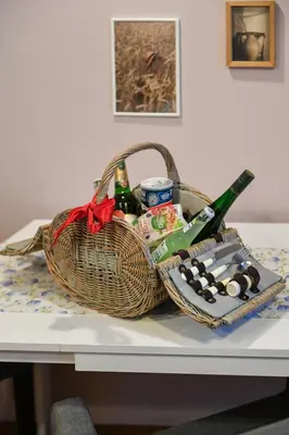 a basket of beer and wine on a table at ANGEL apartment Prague in Prague