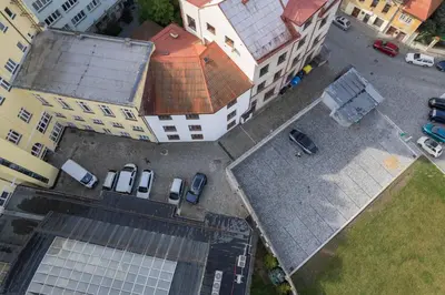 an overhead view of a building with cars in a parking lot at Residence Morris Mladá Boleslav in Mladá Boleslav