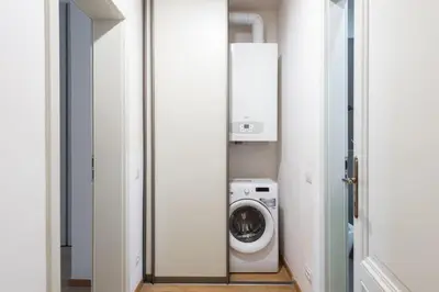 a laundry room with a washer and dryer at Spacious 3-bedrooms apartment near Karlin Square in Prague