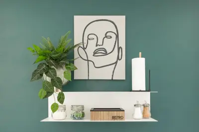 a shelf with a drawing of a man with a candle at Prague Bohemian Rhapsody Suites in Prague