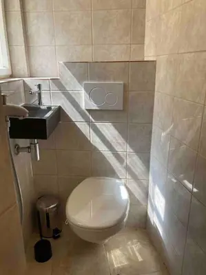 a bathroom with a toilet and a sink at Studio in gothic house, 50m to the Old Town Square in Prague