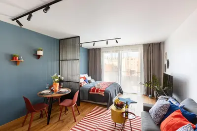 a bedroom with a bed and a table and chairs at Urban Chic Residences in Prague